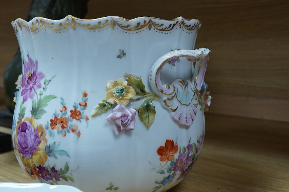 A collection of Meissen porcelain to include floral side plates and a German floral encrusted pot, 18cm high
